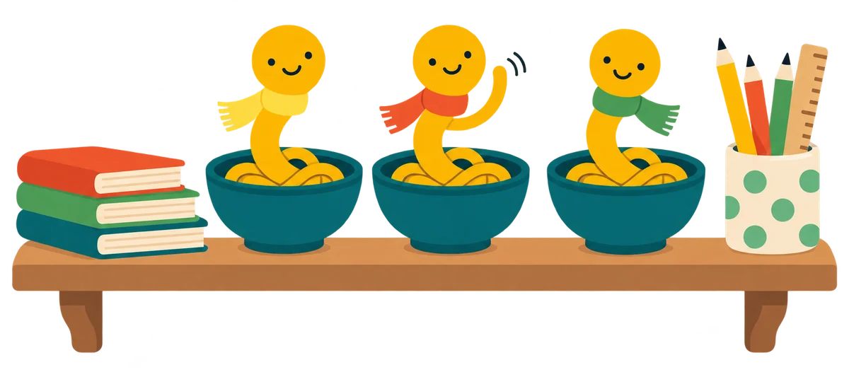 A row of bowls on a classroom shelf, each with a little Noodle in a different coloured scarf, beside books and pencils